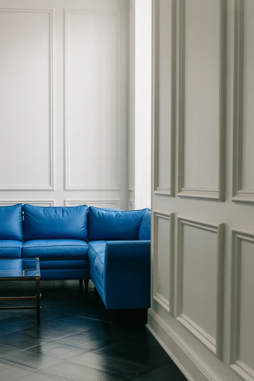 Pair a Royal Blue Sofa with Crisp White Paneling