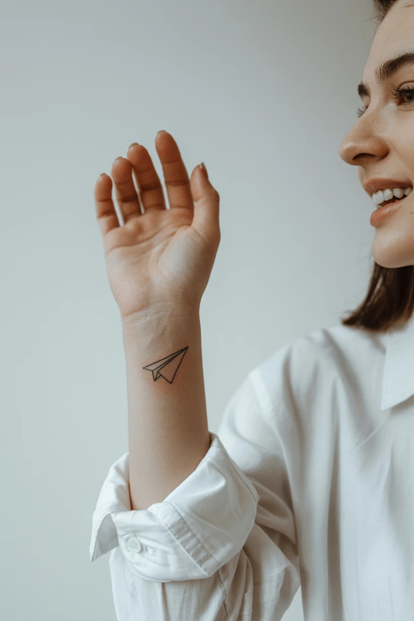 A Minimalist Paper Airplane Near the Wrist